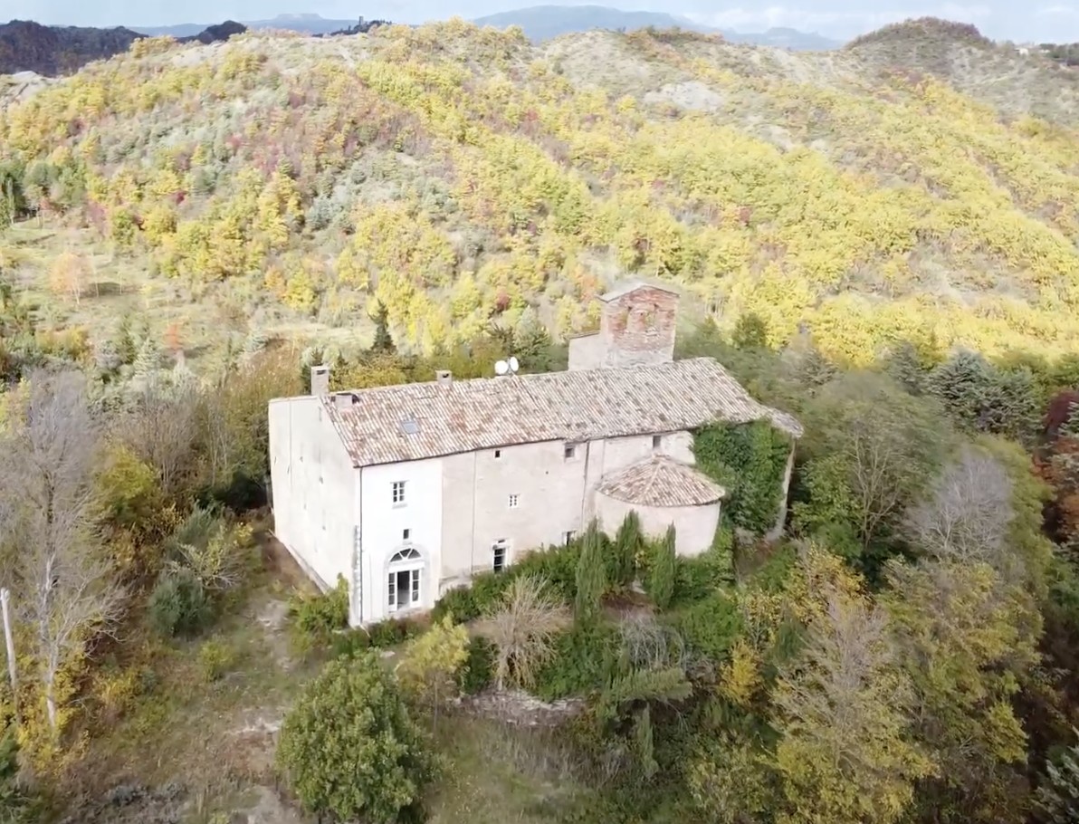 An abbey surrounded by the hills of Le Marche